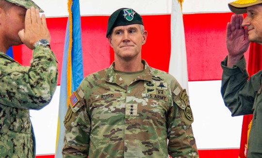 Lt. Gen. Joshua M. Rudd, then-deputy commander of U.S. Indo-Pacific Command, center, officiates a change of command ceremony at Marine Corps Base Camp Blaz Fitness Center, May 15, 2025.
