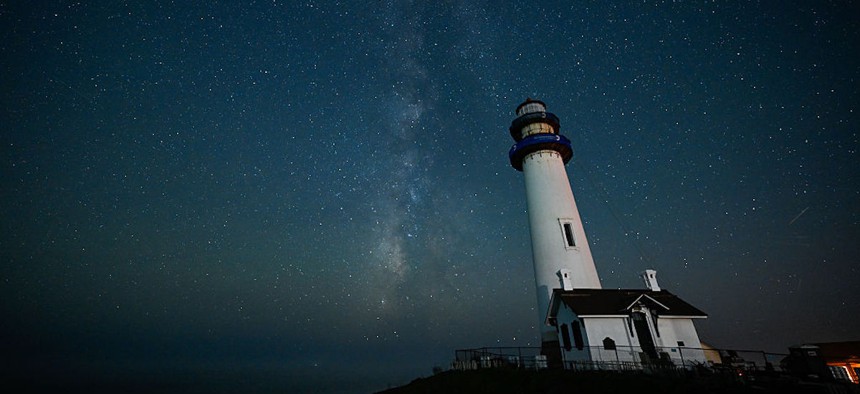 The Milky Way galaxy is seen stretching across the night sky above the Pigeon Point Lighthouse in Pescadero, California, United States, on October 20, 2025.