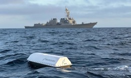 An unmanned surface vehicle made by Saronic Technologies conducts testing during a Navy exercise off the coast of California in 2023.