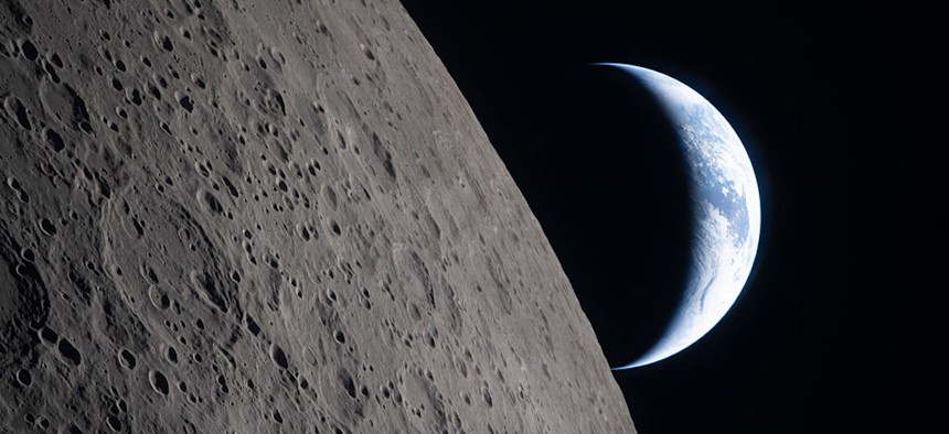 As the Artemis II crew came close to passing behind the Moon and experiencing a planned loss of signal, they captured this image of a crescent Earth setting on the Moon’s limb on April 6, 2026.