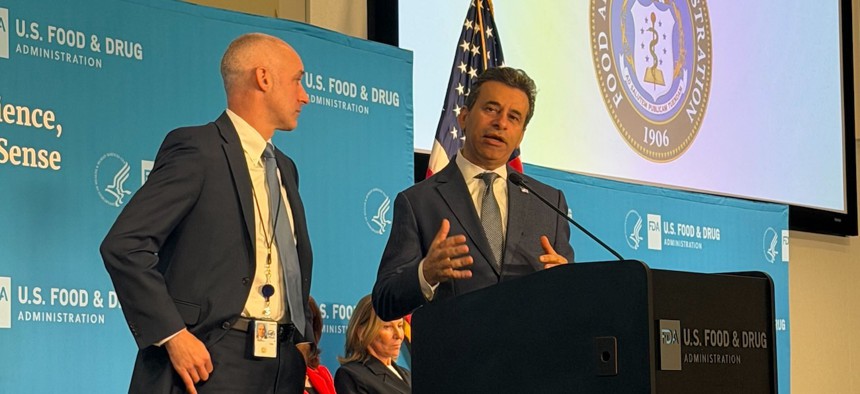 FDA Commissioner Marty Makary (right) speaking Tuesday at the agency's headquarters in Silver Spring, Md., alongside chief artificial intelligence officer Jeremy Walsh.
