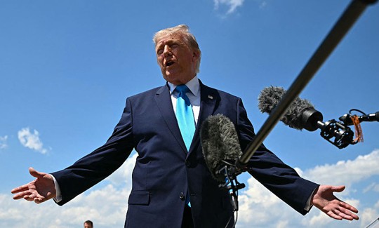 US President Donald Trump speaks to reporters after stepping off Air Force One at Joint Base Andrews, Maryland on May 20, 2026, as he returns to Washington, DC, after delivering the commmencement address to the US Coast Guard Academy's 2026 graduating class.