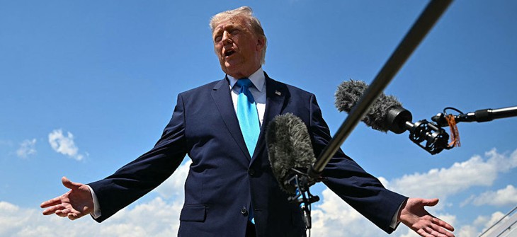 US President Donald Trump speaks to reporters after stepping off Air Force One at Joint Base Andrews, Maryland on May 20, 2026, as he returns to Washington, DC, after delivering the commmencement address to the US Coast Guard Academy's 2026 graduating class.