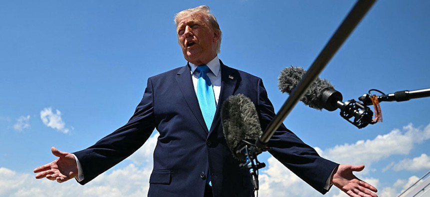 US President Donald Trump speaks to reporters after stepping off Air Force One at Joint Base Andrews, Maryland on May 20, 2026, as he returns to Washington, DC, after delivering the commmencement address to the US Coast Guard Academy's 2026 graduating class.