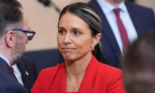 Director of National Intelligence Tulsi Gabbard stands after President Donald Trump spoke about the Iran war from the Cross Hall of the White House on April 1, 2026 in Washington, DC.