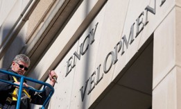 A worker removes the U.S. Agency for International Development sign on their headquarters on February 07, 2025 in Washington, DC. President Donald Trump and Elon Musk's Department of Government Efficiency (DOGE) abruptly shutdown the U.S. aid agency earlier this week leaving thousands unemployed and putting U.S. foreign diplomacy and aid programs in limbo. 