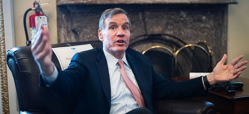 Sen. Mark Warner, D-Va., talks with reporters on "the narrow passage of Republicans' $70 billion immigration enforcement bill signed into law by President Trump," in the U.S. Capitol on Thursday, June 11, 2026.