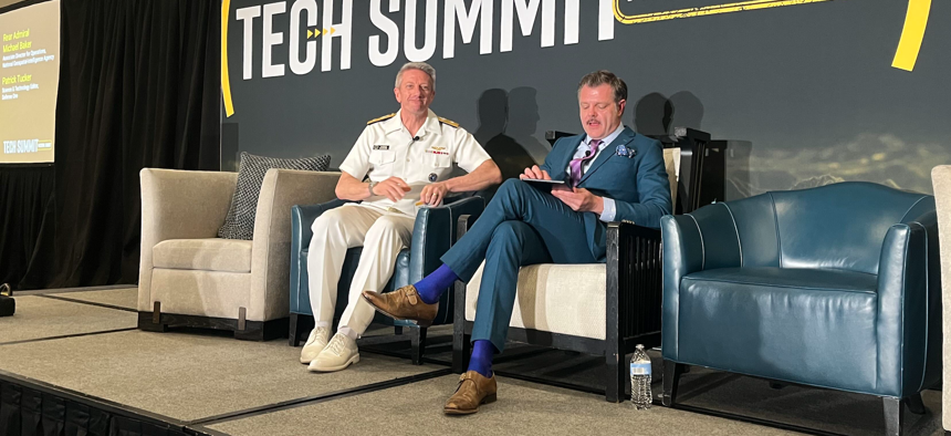Rear Adm. Michael Baker, associate operations director of the National Geospatial-Intelligence Agency, spoke with Defense One's Patrick Tucker at the Defense One Tech Summit in Arlington, Virginia, on June 16, 2026.