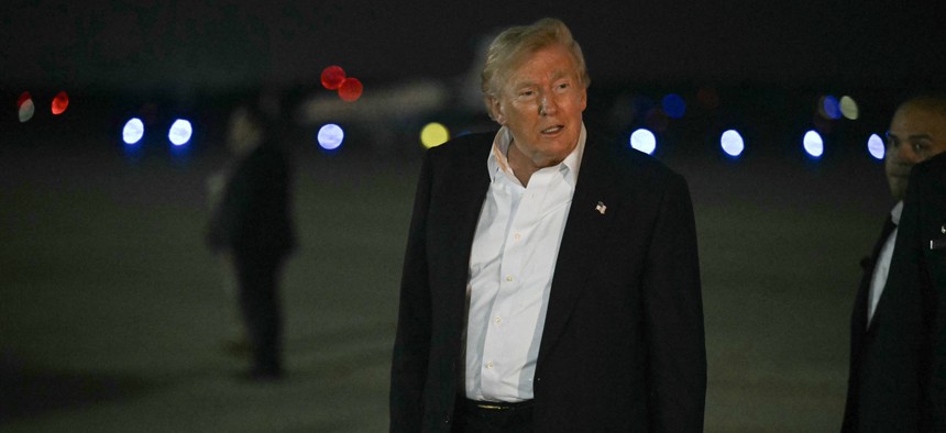 President Donald Trump walks toward his motorcade after he arrived at Joint Base Andrews, Maryland on July 9, 2026.