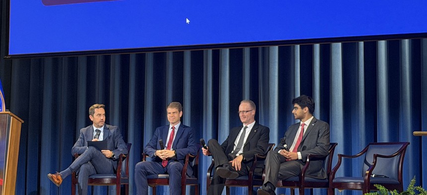 (L to R) GSA Deputy Administrator Mike Lynch speaks with GSA Senior Advisor Matt Batzel, GSA CIO David Shive and Commerce Department Chief Technology Officer Moksh Jawa at the Federal Emerging Technology Showcase held Thursday, July 30 at the Interior Department.