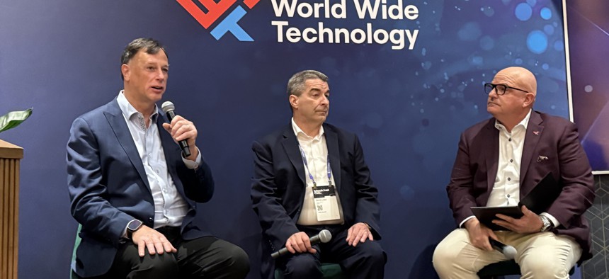 (L to R) Former National Security Agency cybersecurity director Rob Joyce and fellow former NSA cybersecurity director Dave Luber speak with Vice President of Global Cyber at World Wide Technology Chris Konrad at an Aug. 5 World Wide Technology panel held at the Black Hat cyber conference.