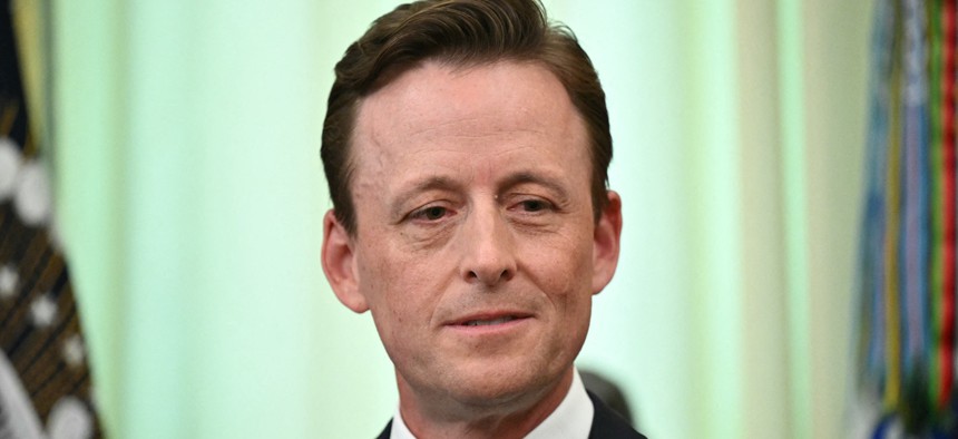 US National Cyber Director Sean Cairncross attends the signing of an executive order in the Oval Office of the White House in Washington, DC, on June 22, 2026.