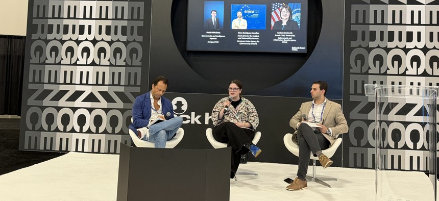 (L to R) Nuno Rodrigues Carvalho, head of sector for Incident and Vulnerability Services at the European Union Agency for Cybersecurity, and Lindsey Cerkovnik, branch chief of vulnerability response and coordination at the Cybersecurity and Infrastructure Security Agency, speak with Nextgov/FCW Cybersecurity Reporter David DiMolfetta Aug. 6 ant the Black Hat cybersecurity conference.