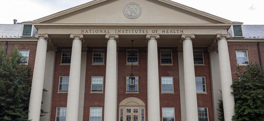 View of the main historical building (Building 1) of the National Institutes of Health (NIH) inside Bethesda campus. U.S. Public Health Service seal is seen on top of it.