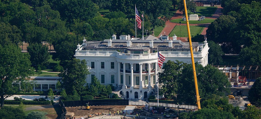 Construction workers install rebar and other materials at the new helipad on the South Lawn of the White House after President Donald Trump ordered changes to the project on August 6, 2026 in Washington, DC.