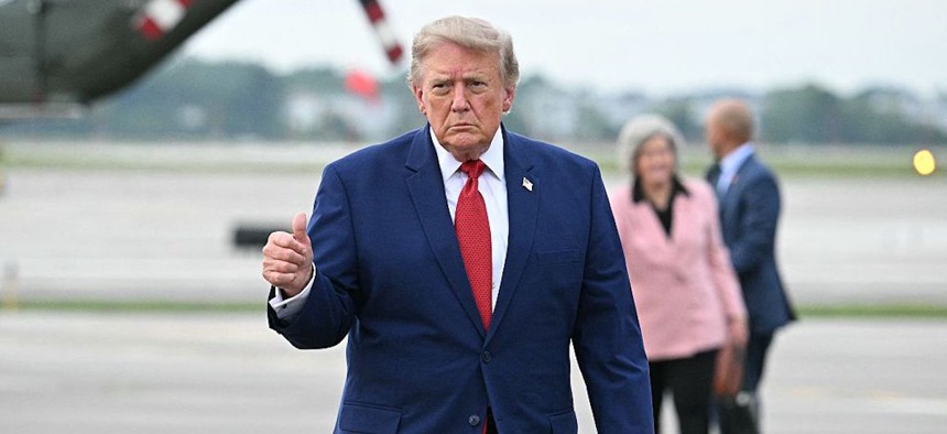 US President Donald Trump gives a thumbs up before boarding Air Force One en route back to Washington, DC, at Cleveland Hopkins International Airport in Cleveland, Ohio on August 11, 2026.