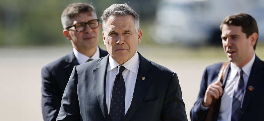 Sen. Dave McCormick (R-PA) (C) stands on the tarmac at John F. Kennedy International Airport on September 21, 2026 in the Queens borough of New York City.