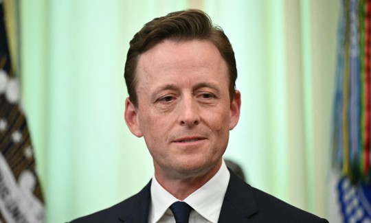 U.S. National Cyber Director Sean Cairncross looks on as President Donald Trump (off frame) signs an executive order in the Oval Office of the White House in Washington, D.C., on June 22, 2026.