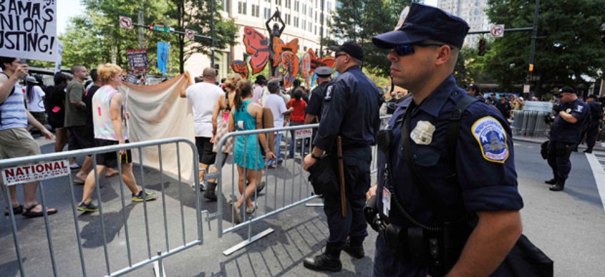Charlotte police officers monitor a protest over the weekend.