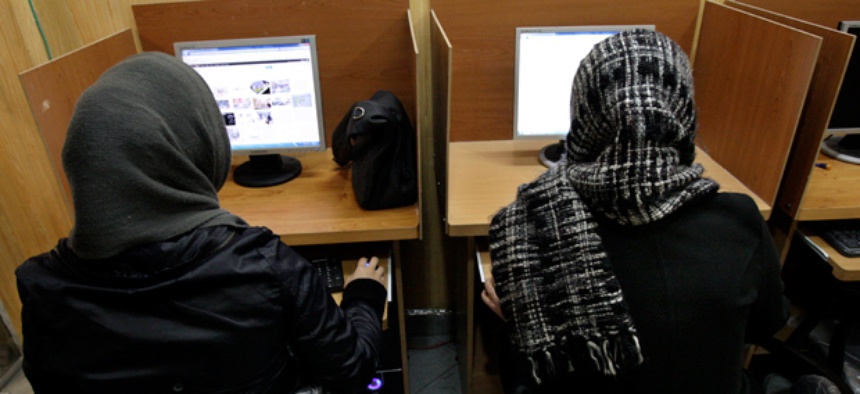 Iranian women use computers at an Internet cafe in central Tehran, Iran.