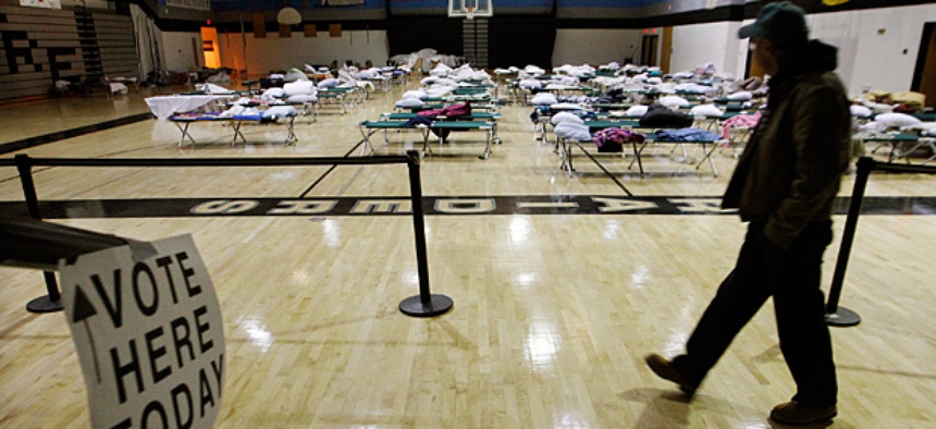 A person walks through a makeshift shelter in Tom's River, NJ as they arrive to vote.