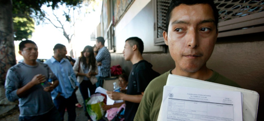 Illegal immigrant Layios Roberto waits with papers outside the offices of Coalition for Humane Immigrant Rights in Los Angeles Wednesday, Aug. 15, 2012.