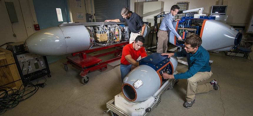 Researchers prepare pods that, airborne, will track radiation to its source and identify nuclear bombs.
