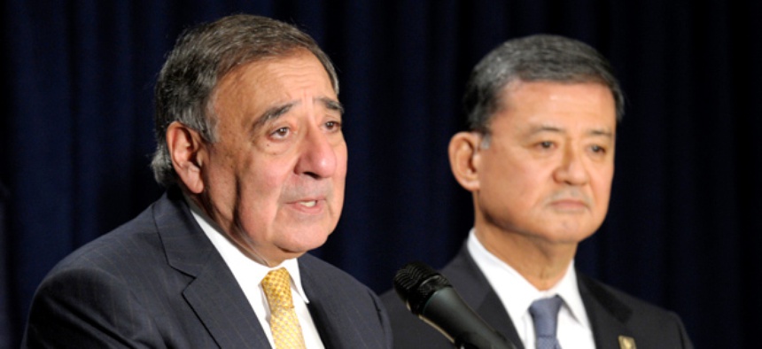 Veterans Affairs Secretary Eric Shinseki listens at right as outgoing Defense Secretary Leon Panetta speaks at the Veterans Affairs Department in Washington, Tuesday, Feb. 5, 2013.