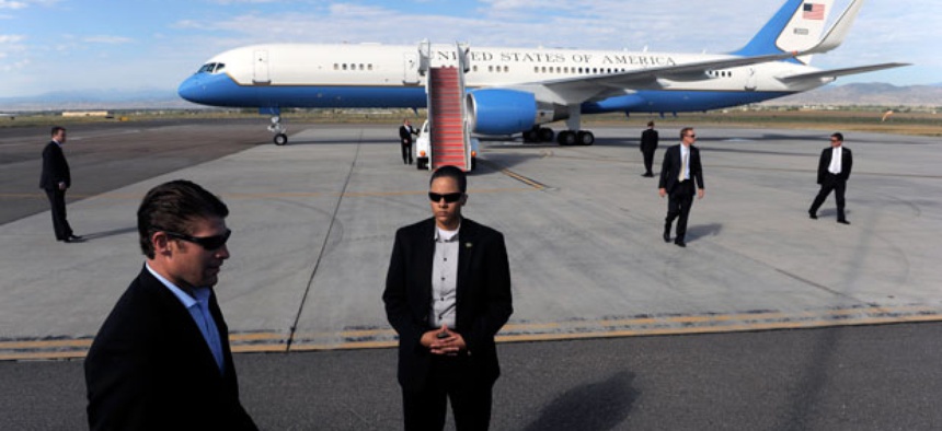 Secret Service agents Members of the Secret Service surround Air Force One as President Barack Obama prepares to depart the plane in September.
