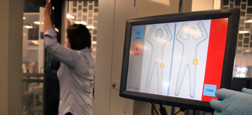 A TSA employee demonstrates an Advanced Imaging Technology scanner at Las Vegas' McCarran International Airport in 2011.