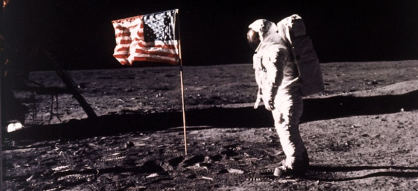 Astronaut Edwin E. "Buzz" Aldrin Jr. poses for a photograph beside the U.S. flag deployed on the moon during the Apollo 11 mission.