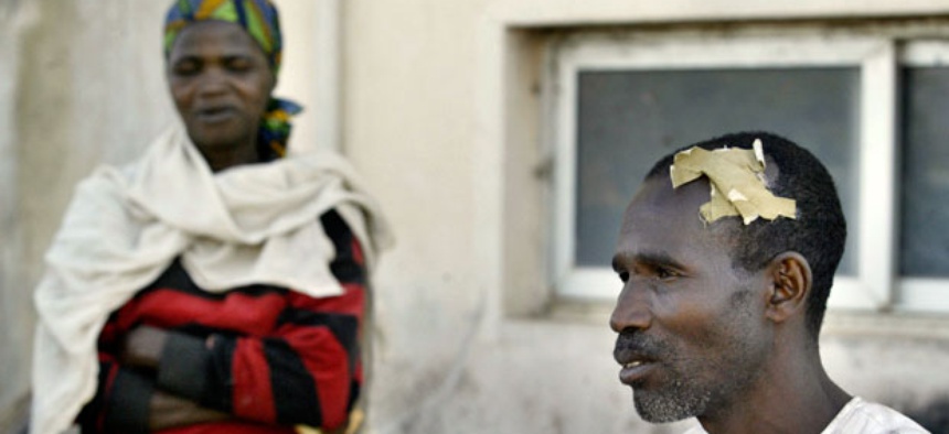 A citizen suffering from a head wound after deadly ethnic and religious rioting, in Jos, Nigeria in 2008.