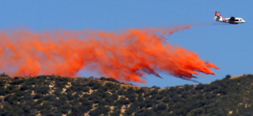 A tanker makes a slurry drop onto a 1,400-acre wildfire northeast of Castaic, Calif., in May.
