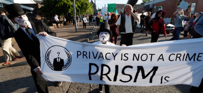 Protestors gather during a demonstration outside of the security perimeter of the G-8 summit in Enniskillen, Northern Ireland Monday.