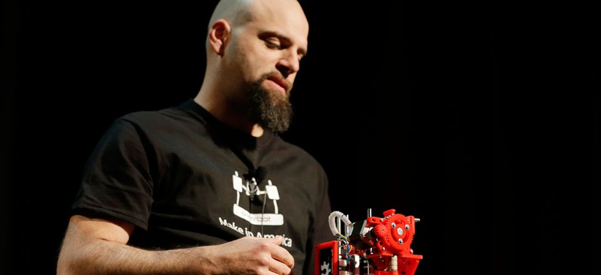 Brook Drum, the founder and CEO of Printrbot, displays and talks about his $299 portable 3D printer during the Hardware Innovation Workshop in San Mateo, Calif.