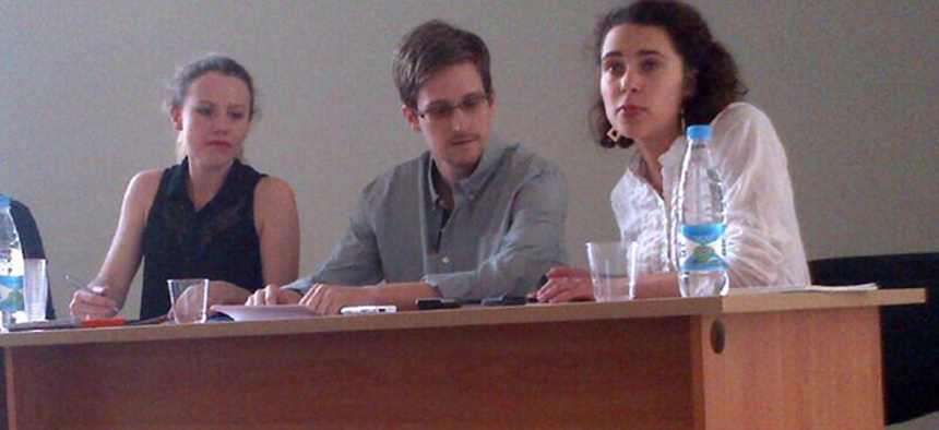 Edward Snowden, flanked by Sarah Harrison of WikiLeaks (right) and an unidentified woman.