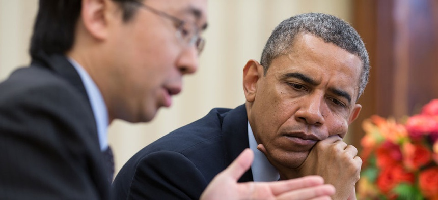 Todd Park and Barack Obama look at information on a tablet computer in April.