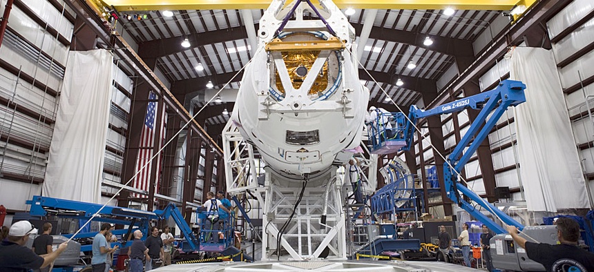 Technicians prepare for the SpaceX 1 mission launch at Cape Canaveral Air Force Station, Fla. in 2012.