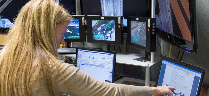 Astronaut Karen Nyberg uses the virtual reality lab in the Space Vehicle Mock-up Facility at Johnson Space Center in January.