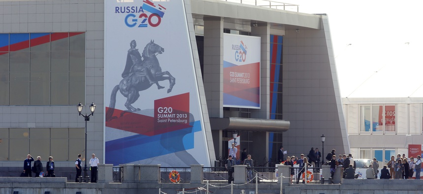 Journalists stand outside the media center of the G20 summit in St. Petersburg Wednesday.
