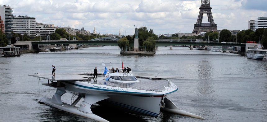 The Turanor PlanetSolar, the world's largest solar boat, travels on the Seine river in Paris, France.