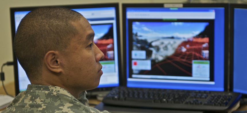 Sgt. Nirundorn Chiv works in the virtual lab at Fort Gordon in 2010.