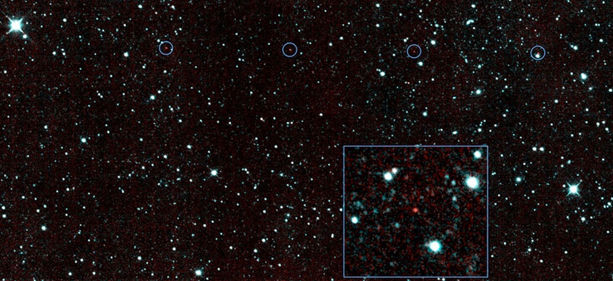 The six red dots in this composite picture indicate the location of the first new near-Earth asteroid seen by NASA's Near-Earth Object Wide-field Infrared Survey Explorer.