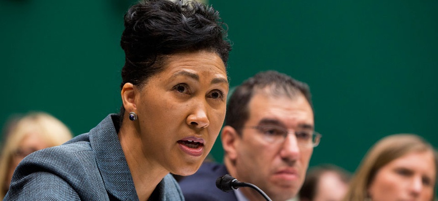 Cheryl Campbell, Senior vice president of CGI Federal, left, testifies on Capitol Hill in October.