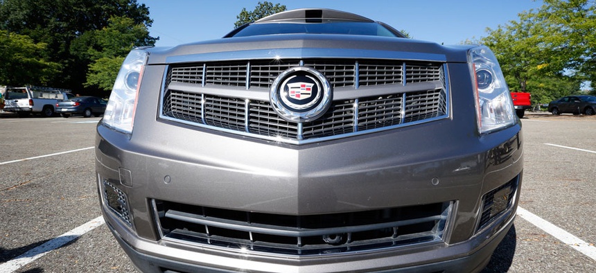 Infrared sensors and a low mounted camera can be seen below the bumper of this Cadillac SRX that was modified to be driverless by Carnegie Mellon University.