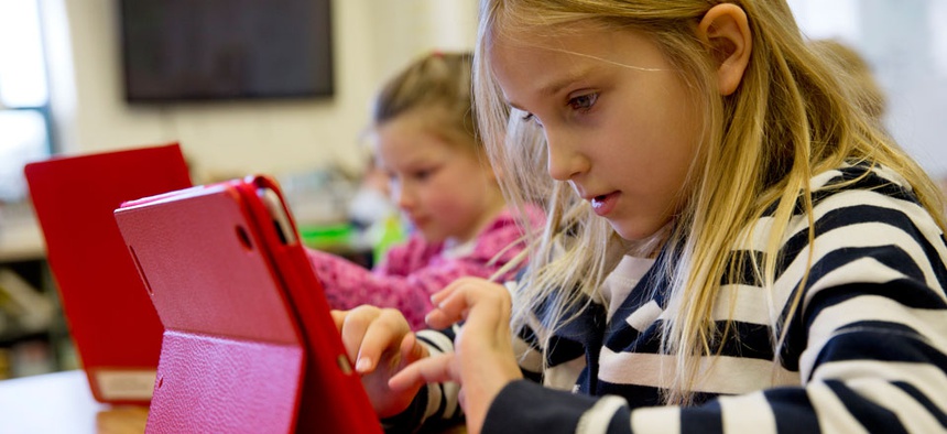 Ella Russell, 7, working on an e-book on an iPad during her second grade class at Jamestown Elementary School in Arlington, Va., in November.