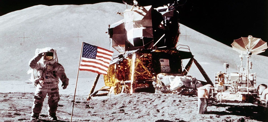 Apollo 15 Lunar Module Pilot James B. Irwin salutes while standing beside the fourth American flag planted on the surface of the moon, July 30, 1971.