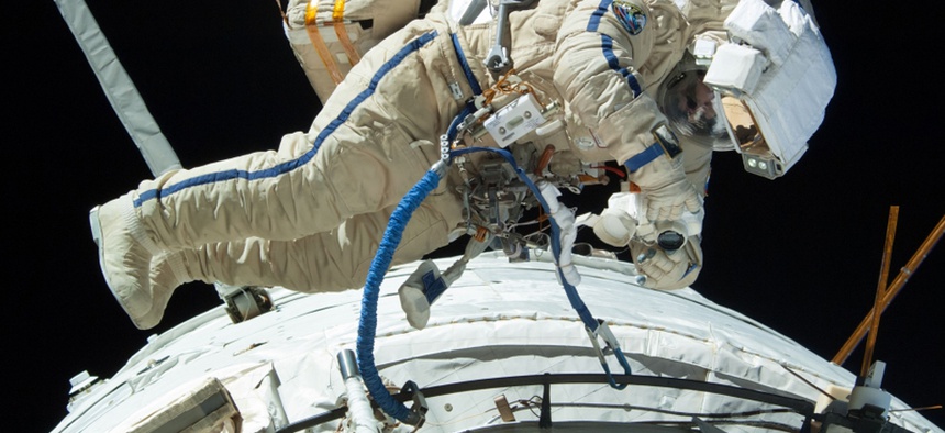 Russian cosmonaut Alexander Misurki works on the International Space Station in 2013.