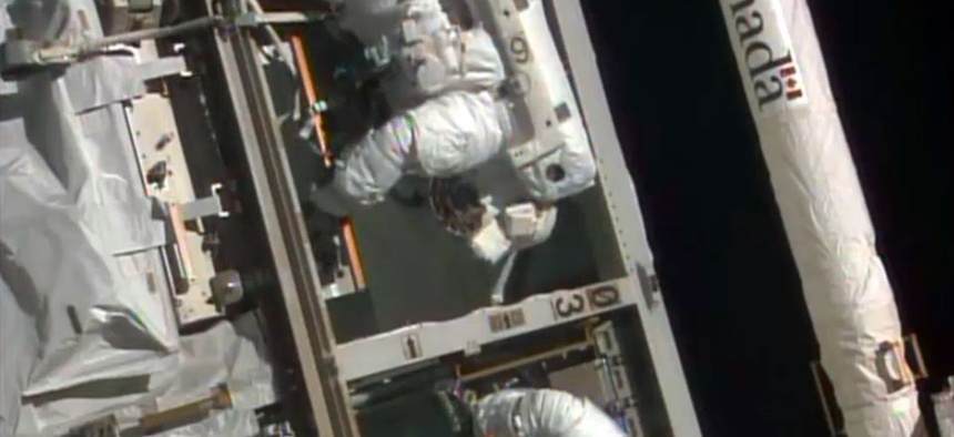 NASA astronauts Steven Swanson, left, and Rick Mastracchio perform a spacewalk outside the International Space Station.