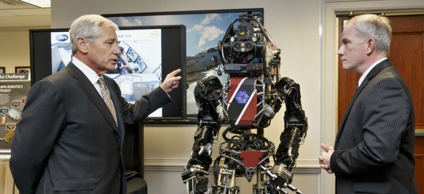 Defense Secretary Chuck Hagel gets a look at one of the latest robotics projects from DARPA